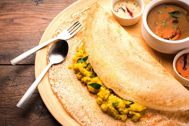 Premium Photo Masala Dosa Is A South Indian Meal Served With Sambhar And Coconut Chutney