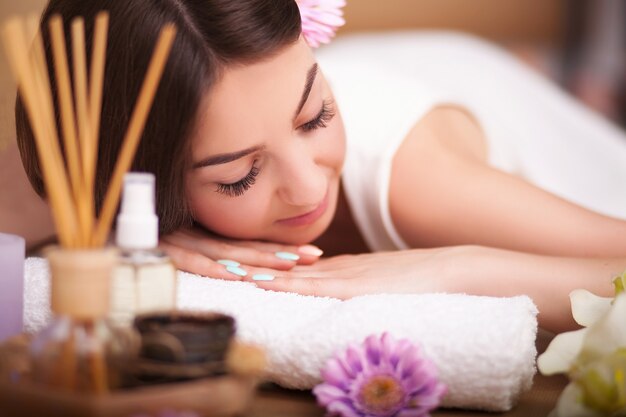 Masseur Doing Massage On The Back Of Woman In The Spa Salon Photo