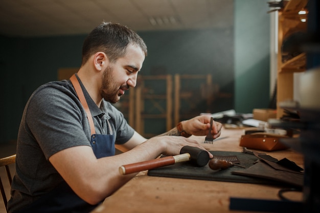 Premium Photo | Master tanner works in workshop