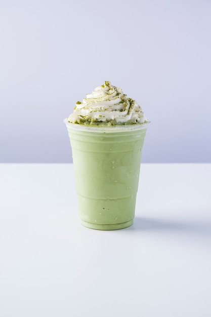 Premium Photo | Matcha frappe with whipped cream, green tea milkshake