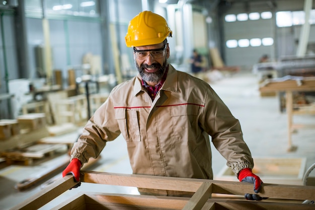 Premium Photo Mature Man Working In Furniture Factory