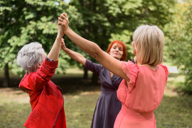 Free Photo Mature Women Playing Together In The Park