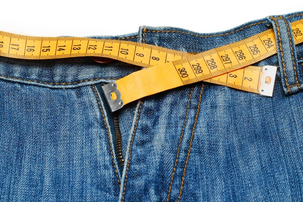 Premium Photo | Measuring tape around trousers