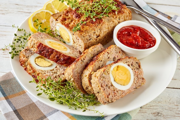 Premium Photo | Meatloaf stuffed with hard-boiled egg