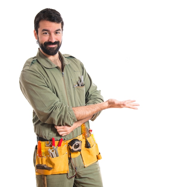 Mechanic presenting something Free Photo