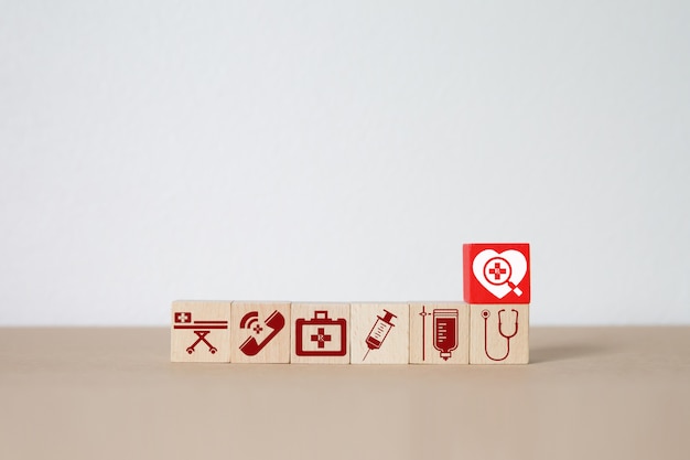 Medical and health icons on wood block . Premium Photo