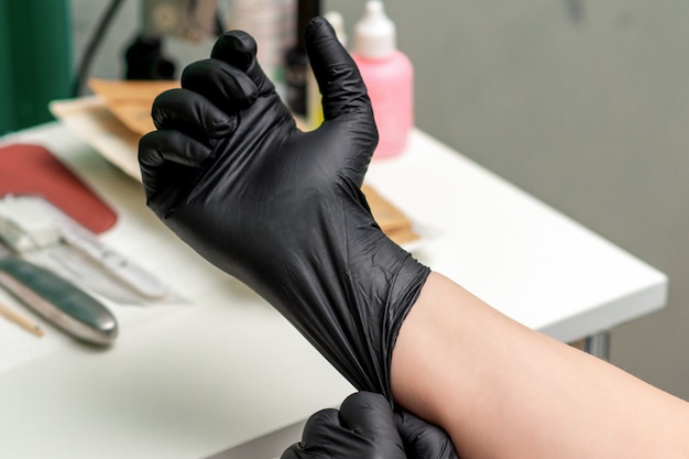 Medical Latex Black Gloves On Hand Of Nurse Or Beautician Premium Photo