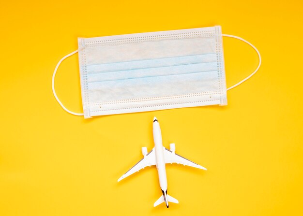 Download Premium Photo Medical Mask Travel Airplanes Yellow Background Problems Traveling By Covid 19 PSD Mockup Templates