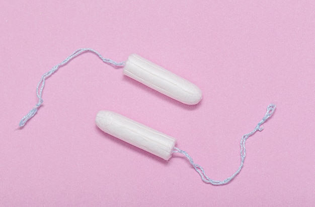 Premium Photo | Medical white tampon on pink background, hygienic ...