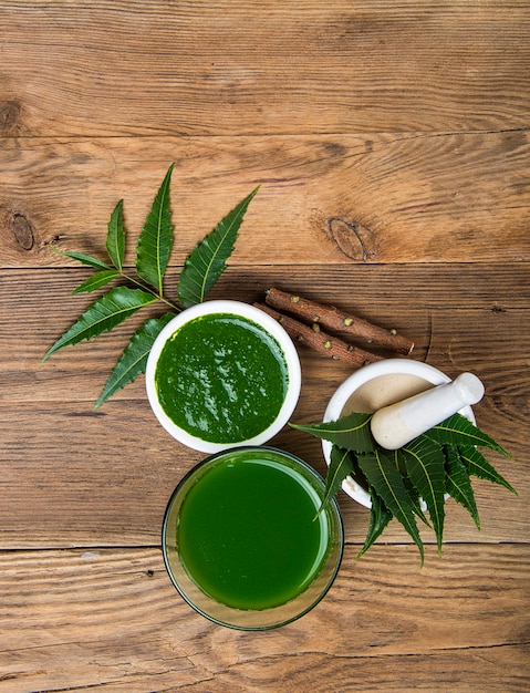 Premium Photo | Medicinal neem leaves in mortar and pestle with neem ...