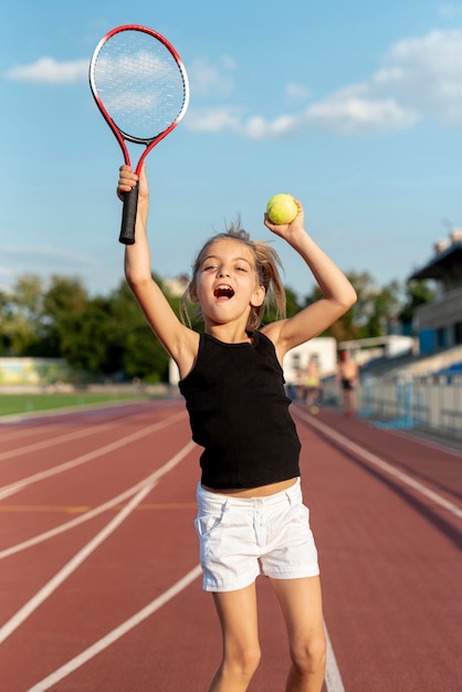 Medium shot of girl playing tennis Free Photo