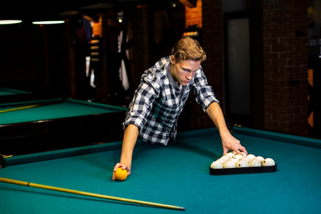 Free Photo | Medium shot guy at billiard night