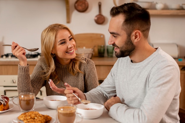 Free Photo | Medium shot happy couple at table