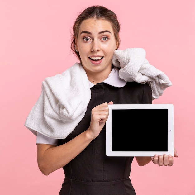 Free Photo Medium Shot Happy Maid Holding A Tablet