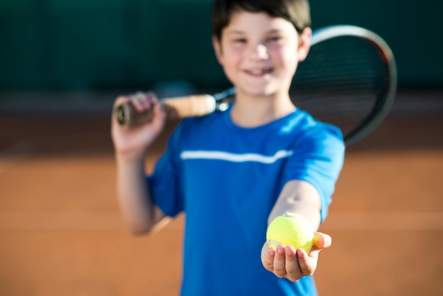 Free Photo Medium Shot Kid Holding A Tennis Ball In Hand