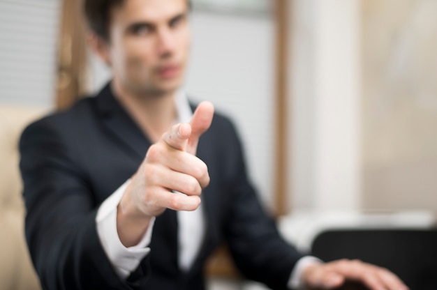 Medium Shot Of Man Pointing At Camera Photo 