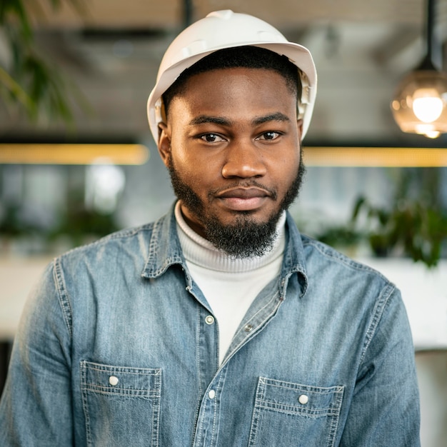 Free Photo | Medium shot man posing with helmet