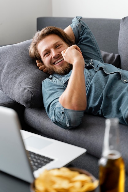 Premium Photo | Medium shot smiley man on couch