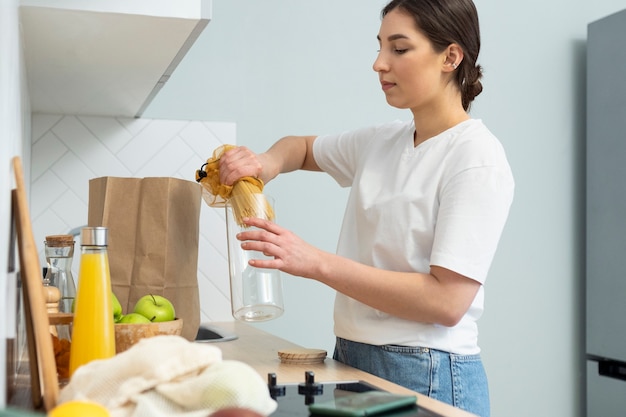 Free Photo | Medium shot woman holding container