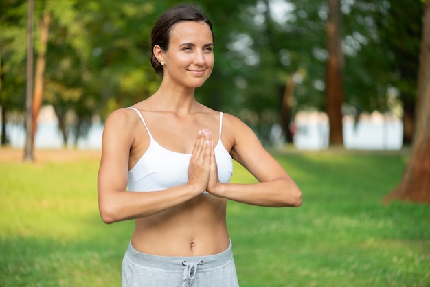 Free Photo | Medium shot woman with meditating arm pose