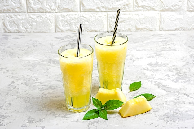 Melon Lemonade Smoothie With Ice And Basil In A Glass On The Gray Table Summer Refreshing And Detox Drink Rustic Style Premium Photo