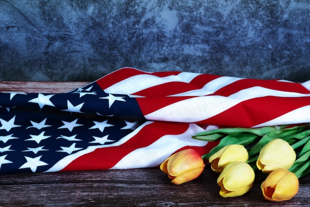 Memorial Day With American Flag And Flower On Wooden Background Photo