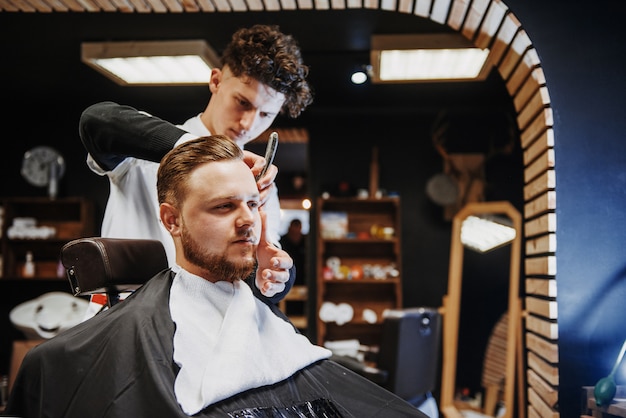 Premium Photo Men S Hairstyling And Haircutting In A Barber Shop Or Hair Salon