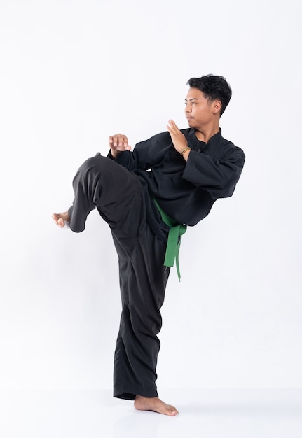 Premium Photo | Men wearing pencak silat uniforms with green belts ...