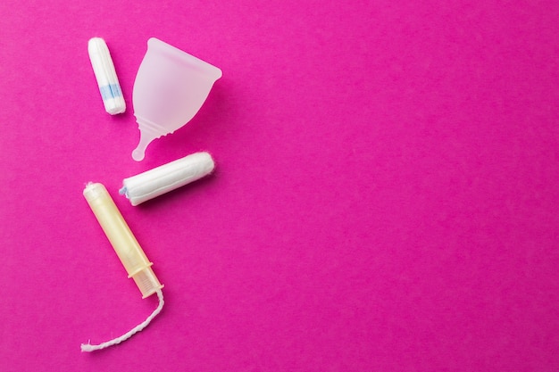 Premium Photo | Menstrual cup and medical tampon close up