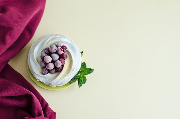 Premium Photo Meringue Dessert With Cranberry Berries Mint On Yellow Background With Copy Space Top View Of Anna Pavlova With Whipped Cream