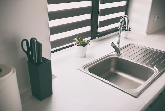 Download Free Metal Faucet In The Modern Gray Kitchen Premium Photo Use our free logo maker to create a logo and build your brand. Put your logo on business cards, promotional products, or your website for brand visibility.