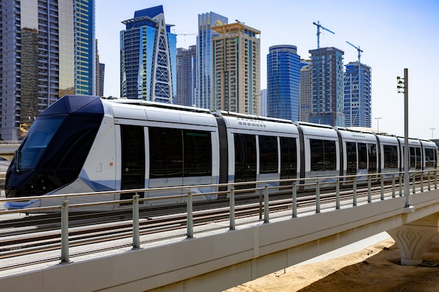 Premium Photo | Metro railway train in dubai city in uae