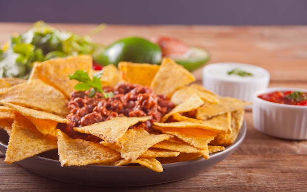 Premium Photo | Mexican corn chips nachos with salsa dip