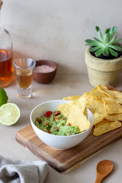 Premium Photo | Mexican dip sauce guacamole with nachos chips. mexican ...