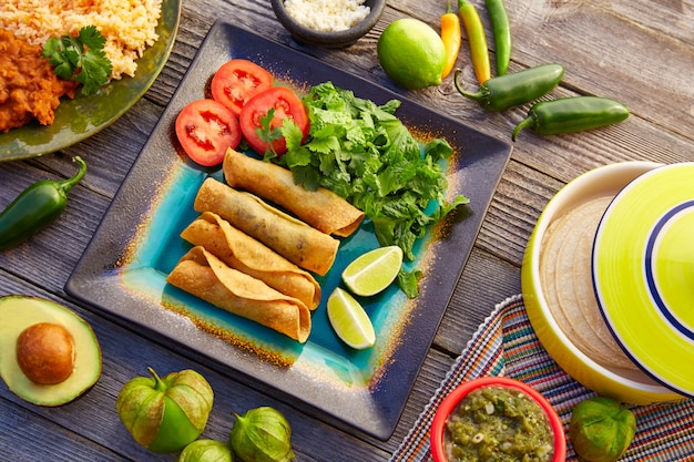 Premium Photo | Mexican flautas rolled tacos with salsa