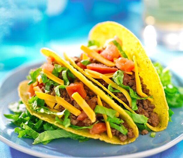 Premium Photo Mexican Food Hard Shell Tacos With Beef Cheese Lettuce And Tomatoes 4321