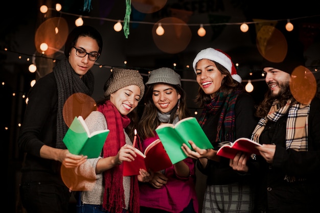 Premium Photo | Mexican posada, mexican friends singing carols in