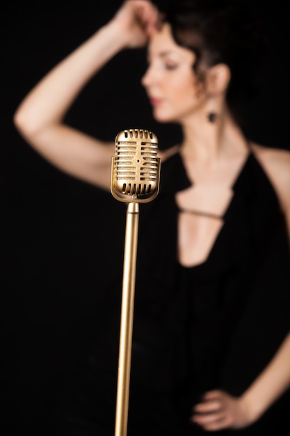 Microphone with blur woman Free Photo