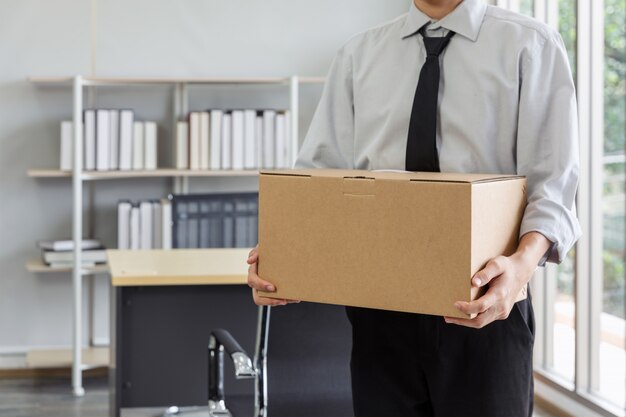 Premium Photo Midsection Of Businessman Moving Office Packing Boxes