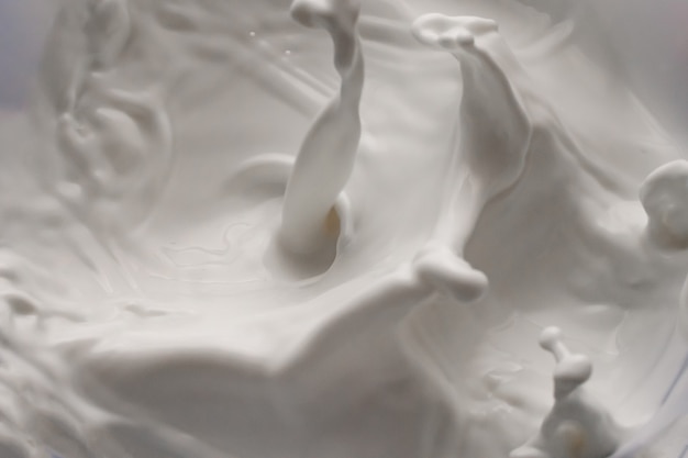 Premium Photo Milk Splashing Waves Isolated White Background
