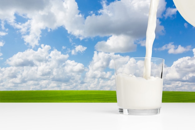 Milk on a table on blue sky Premium Photo