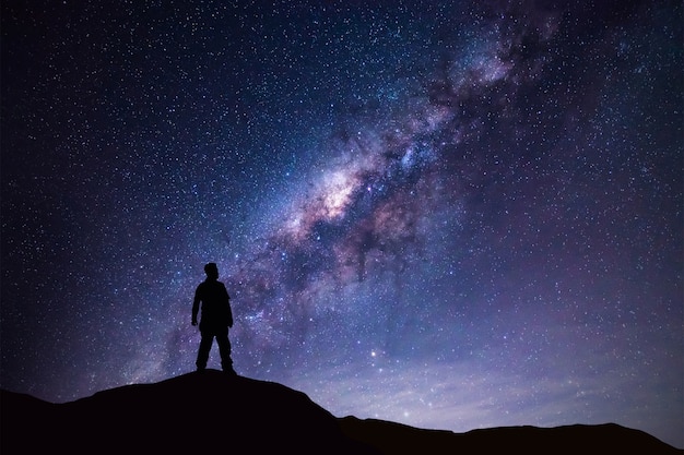 Premium Photo | Milky way landscape silhouette man standing on mountain