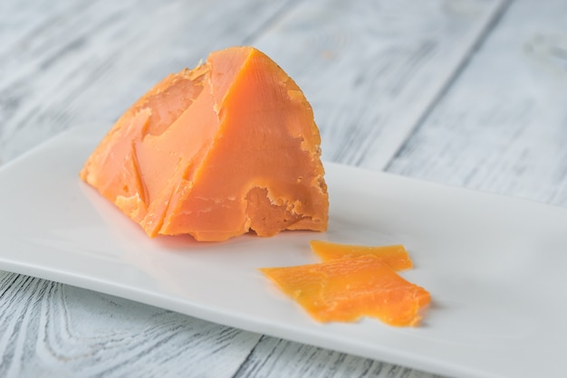 Premium Photo | Mimolette cheese on white plate