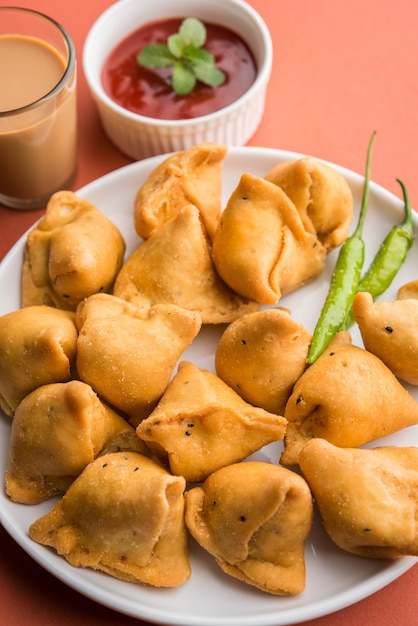 Premium Photo | Mini or small samosa with sauce and hot tea