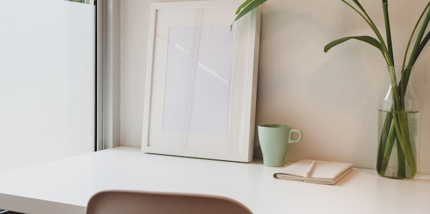 Minimal workplace with mock up frame and copy space Premium Photo