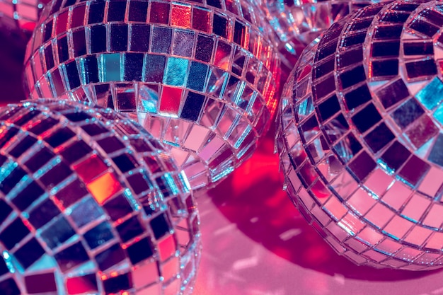 Premium Photo | Mirror disco balls over pink background. party ...