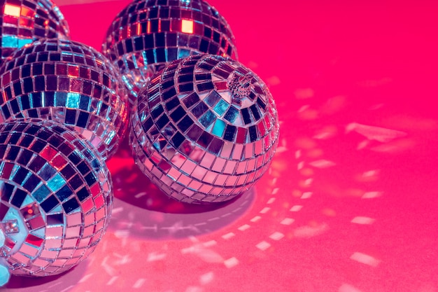 Premium Photo | Mirror disco balls over pink . party, nightlife