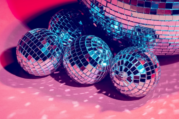 Premium Photo | Mirror disco balls over pink . party, nightlife