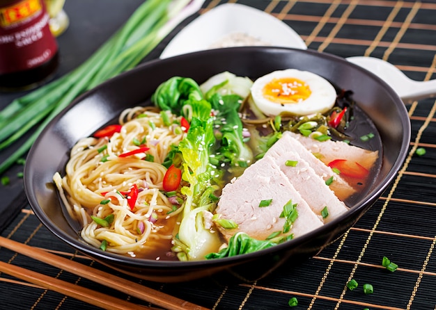 Premium Photo | Miso ramen asian noodles with egg, pork and pak choi ...