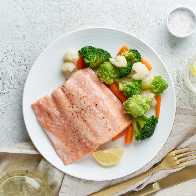 Premium Photo | Mix of boiled vegetables and salmon